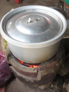 image of traditional Cambodian cooking pot over charcoal burner 